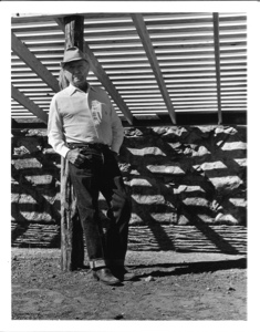 Image of Watt Standing at Sheep Shed in Restoration Process