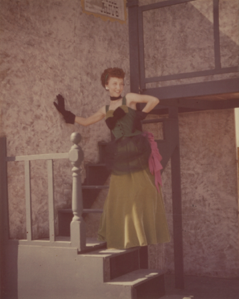 Image of Fandangle Costume - Maida Bee Scott with Hand on Wall