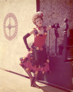 Image of Fandangle Costume - Margie Sedwick Bray with Arm on Bannister