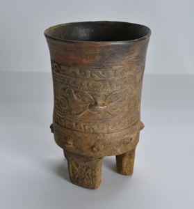 Image of Cylinder Tripod Vessel with Slab Feet and Curly Face Deity