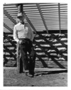 Image of Watt Standing at Sheep Shed in Restoration Process